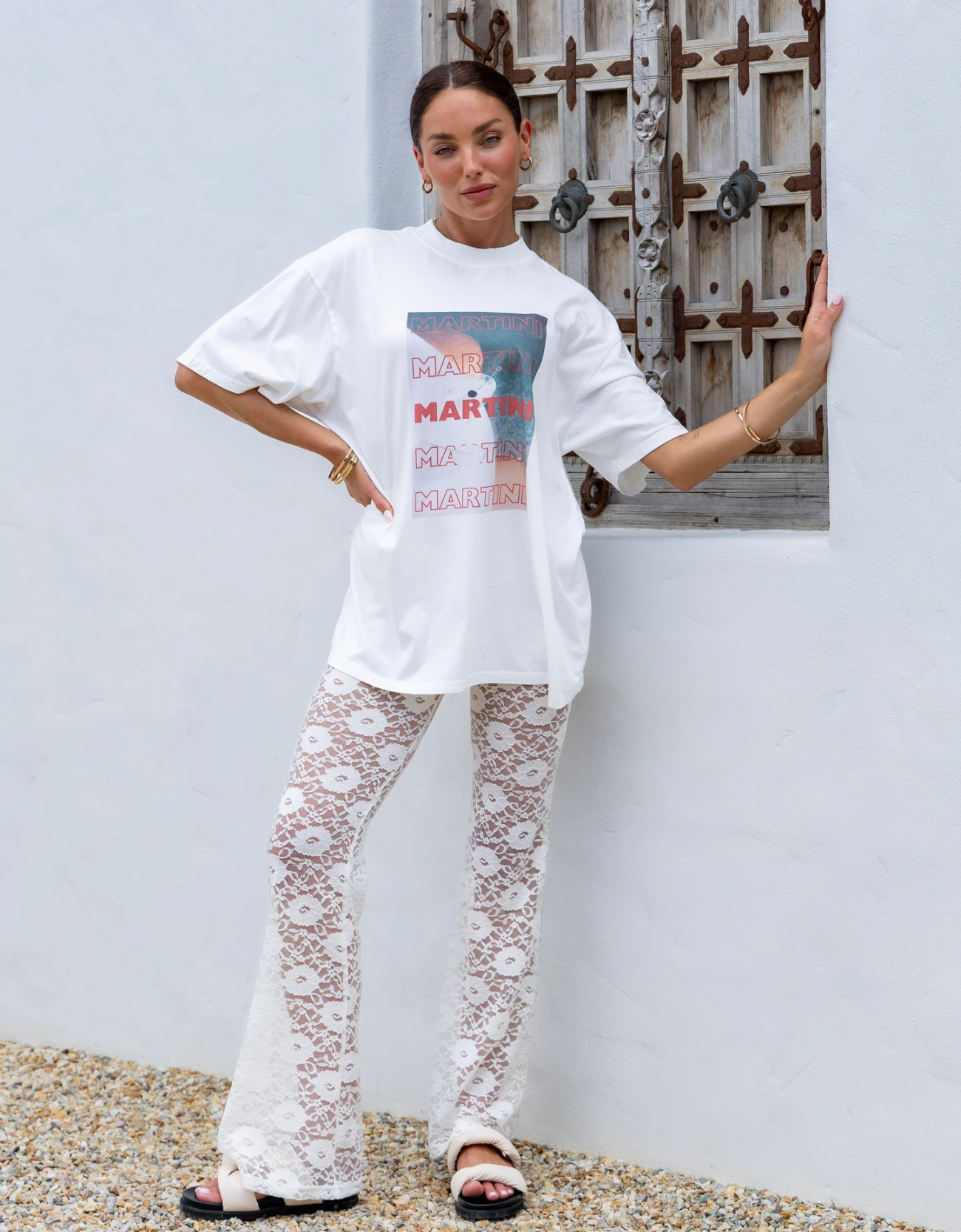 The Martini Tee by Peach & Parla is a classic white T shirt with martini motif