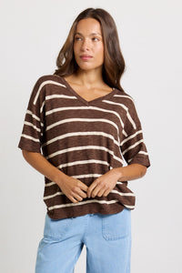 Betty Basics Aries V-Neck Knit Top in Chocolate — front view of relaxed cotton-viscose knit top in chocolate and cream stripe with V neckline and elbow-length sleeves, styled with light blue wide-leg jeans.
