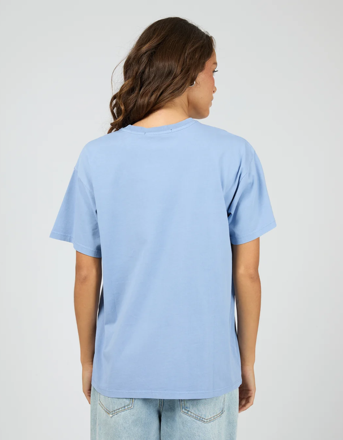 Silent Theory Logo Tee in Light Blue – back view showing relaxed boxy oversized silhouette, drop shoulders and clean finish on heavyweight light blue cotton jersey tee

