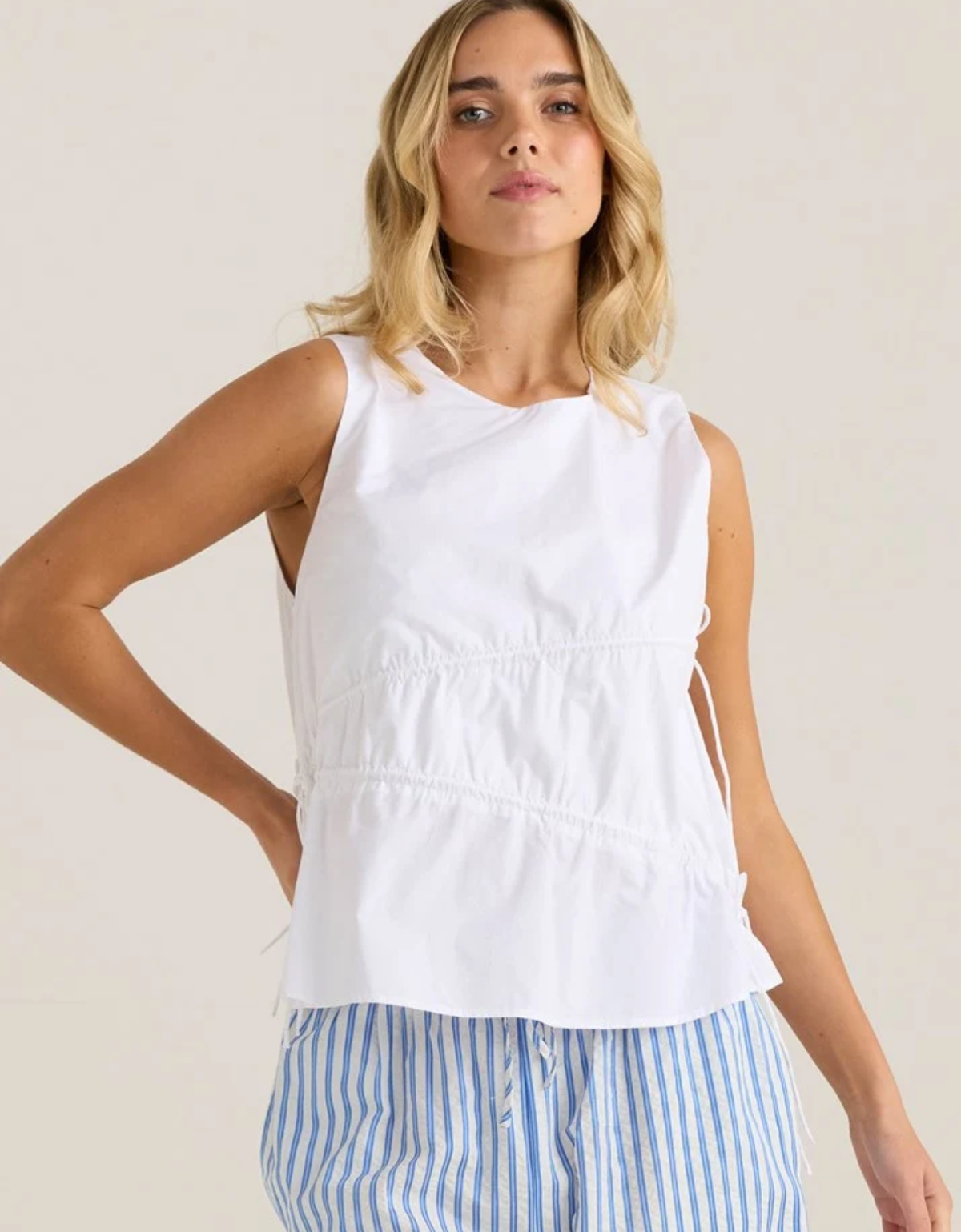 Sass Elin Gathered Tie Top in white, showing its round neckline, sleeveless cut and gathered detailing across the front.