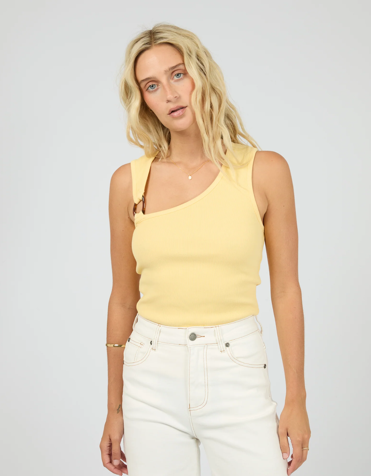 All About Eve Willow Rib Tank in Yellow, front view showing asymmetric neckline and tortoiseshell shoulder detail.