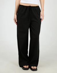 All About Eve Timeless Drawstring Pant Black - close up front view showing elasticated drawstring waistband and wide leg silhouette with black sandals
