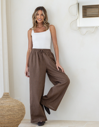 Smaibulun London Wide Leg Cotton Pants in Brown Check, front view on model showing drawstring waist and full-length wide legs.