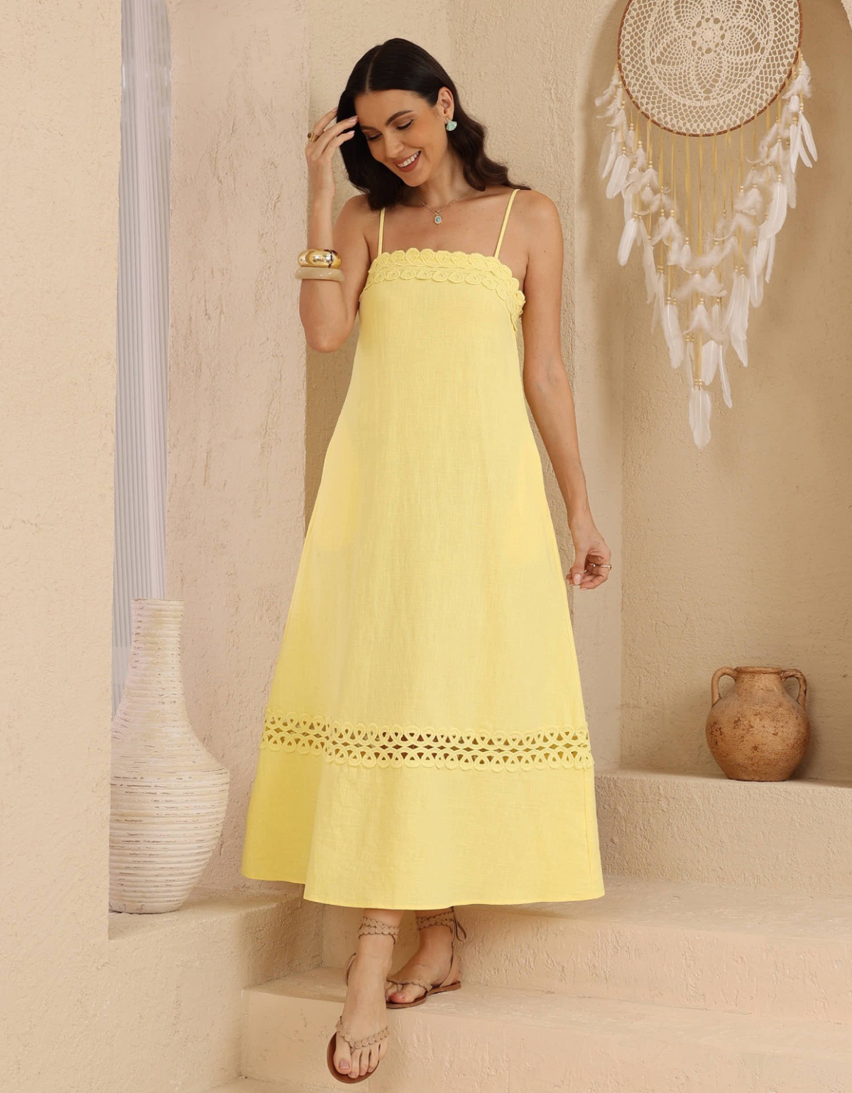 Front view, Model wearing the Iris Maxi Gemma Maxi Dress in Yellow, showing the lace-trimmed neckline and flowing A-line skirt.
