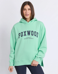 Front view of a model wearing the Foxwood Interval Hoodie in Bright Mint & Navy with an oversized relaxed fit and classic hood

