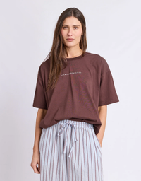 Front view of a model wearing the Foxwood Captain Tee in Chocolate with an oversized relaxed fit and classic round neckline