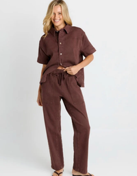 Betty Basics Quinn Cotton Jogger in Chocolate – full-length front view, model wearing relaxed straight-leg chocolate joggers with matching Quinn Cotton Shirt and sandals

