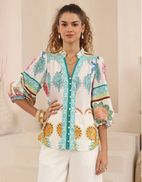 Front view of the Iris Maxi Coco Blouse with colourful botanical print, turquoise button trim and gathered sleeves.